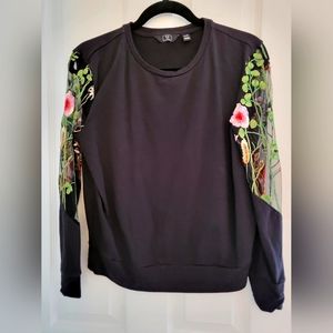 Black blouse with see-through embroidered flower sleeves